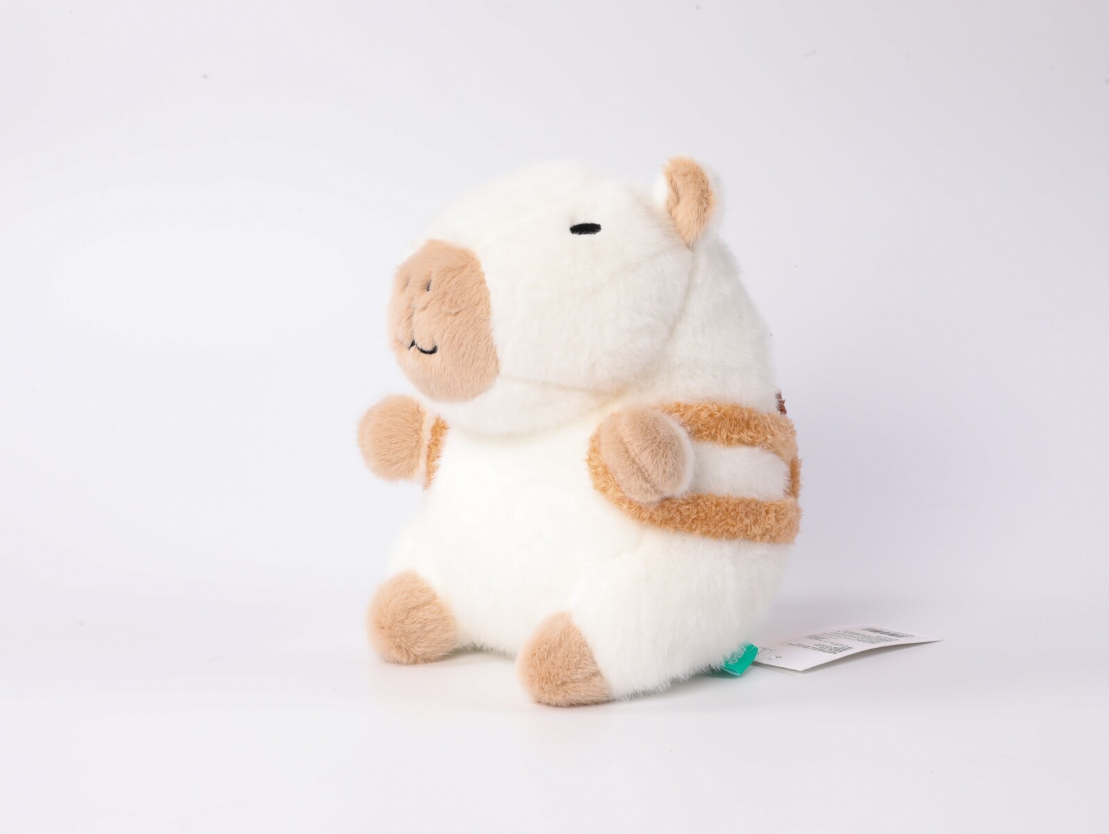 PELUCHE DE 23 CM (CAPIBARA BLANCO CON MOCHILA MARRÓN) 