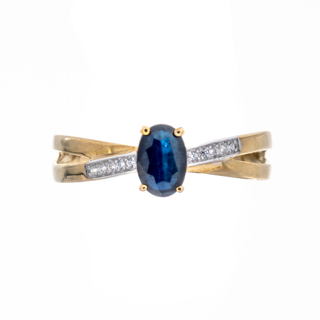 Anillo de oro 9 ktes con circonia y zafiro azul. Anillo de oro 9 ktes con circonia y zafiro azul.
