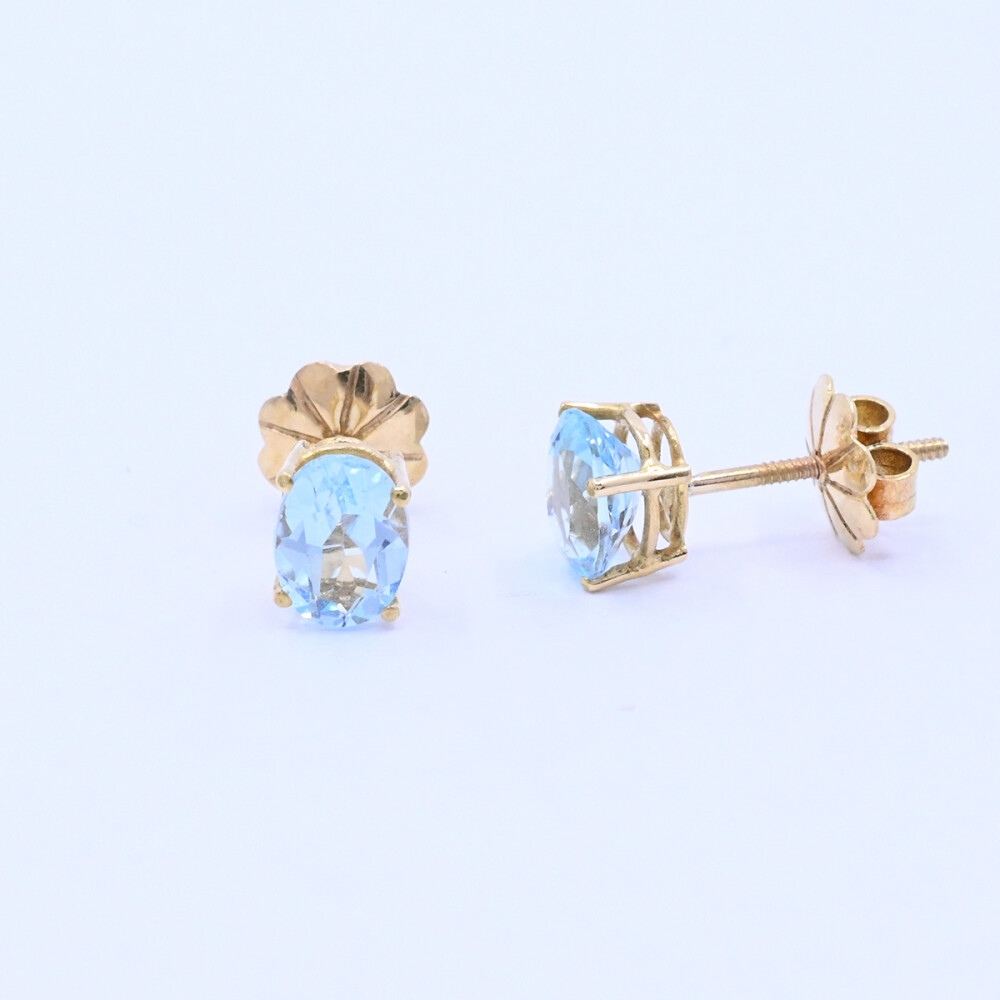 Caravanas oro 18k con topacios celestes oval. Caravanas oro 18k con topacios celestes oval.
