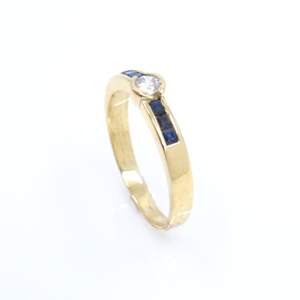 Anillo en oro 18k , brillante y zafiros Anillo en oro 18k , brillante y zafiros