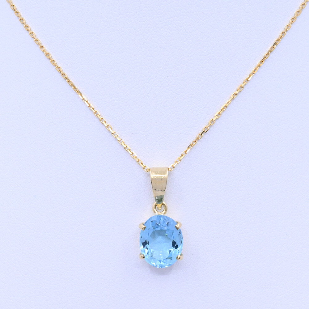 Colgante oro 18k con topacio oval engarce 4 puntas. Colgante oro 18k con topacio oval engarce 4 puntas.