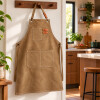Delantal de Cocina en Tela Canvas con Bolsillos y Detalles en Eco Cuero Camel