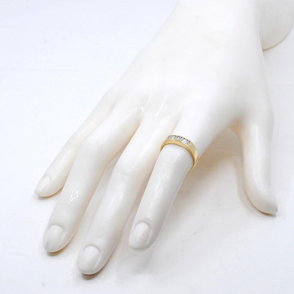 Anillo medio sin fin en oro 18k y brillantes baguettes Anillo medio sin fin en oro 18k y brillantes baguettes