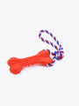 HUESO CON CUERDA ROJO