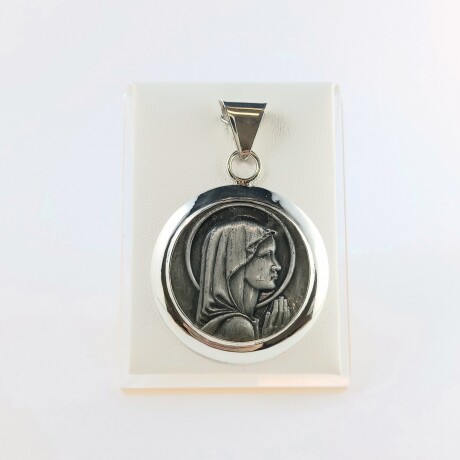 Medalla de la Virgen Niña en plata 925. Medalla de la Virgen Niña en plata 925.