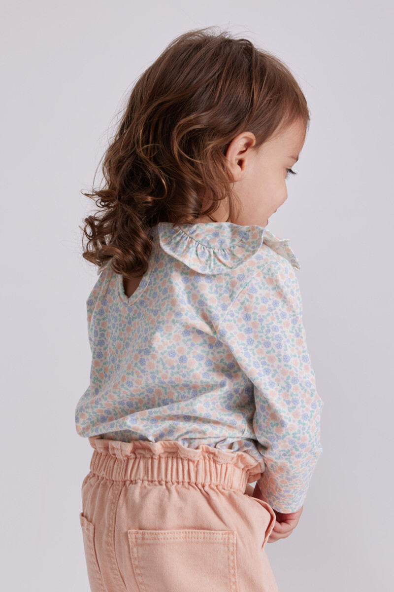 Remera manga larga cuello Flores Crema