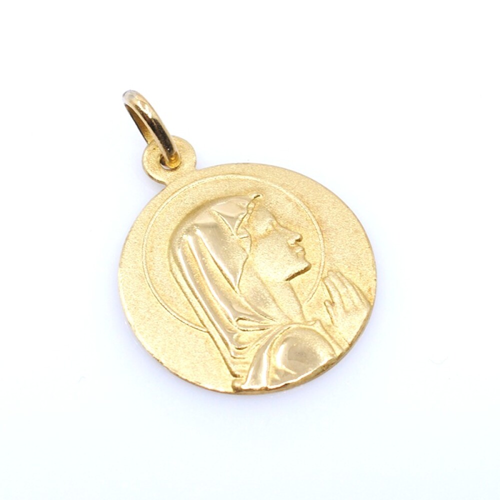 Medalla en oro 18k amarillo, con virgen. Diámetro 18mm Medalla en oro 18k amarillo, con virgen. Diámetro 18mm