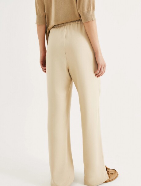 PANTALÓN DE TIRO ALTO CON BOLSILLOS BEIGE