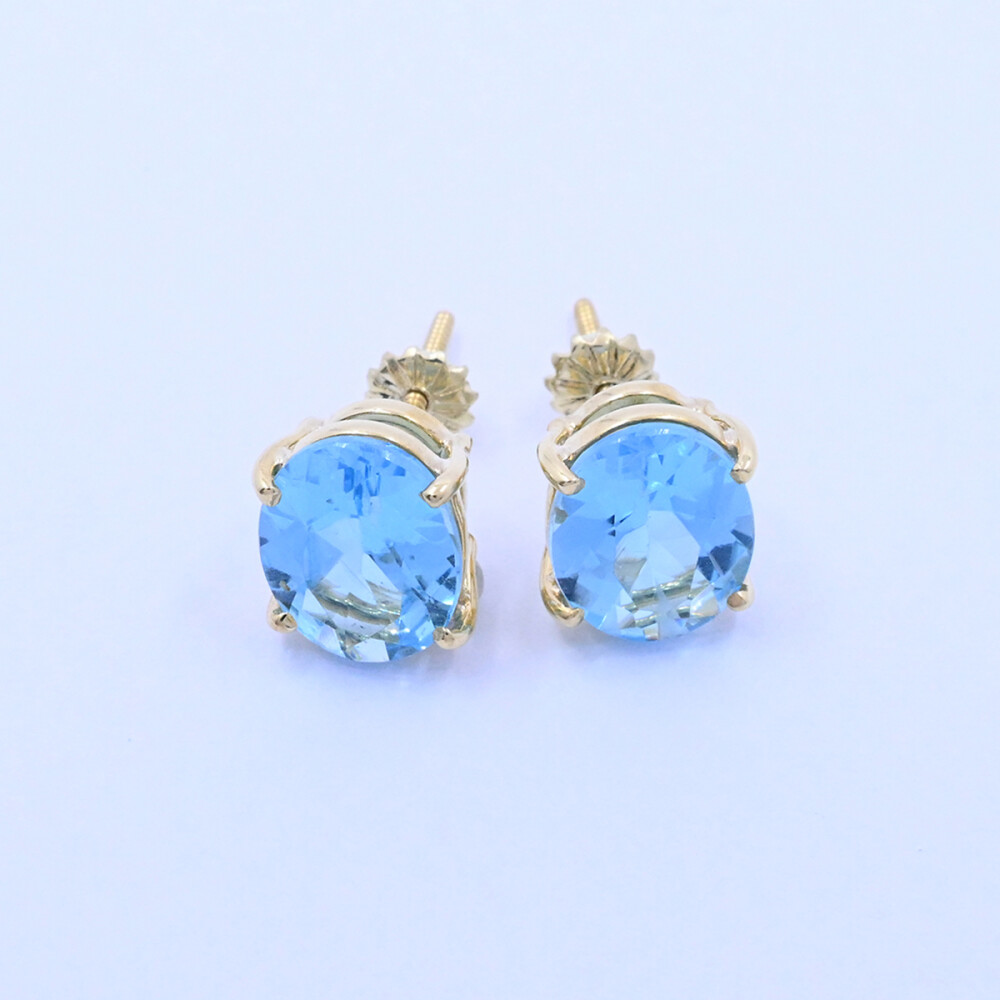 Caravanas oro 18k con topacios azules oval engarce 4 puntas. Caravanas oro 18k con topacios azules oval engarce 4 puntas.
