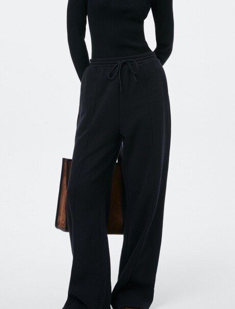 PANTALÓN CON BOLSILLOS - BLANCO NEGRO