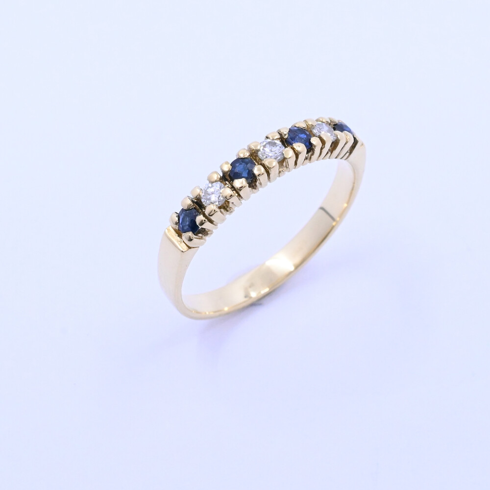Anillo medio sin fin oro 18k amarillo con zafiros y brillantes. Anillo medio sin fin oro 18k amarillo con zafiros y brillantes.