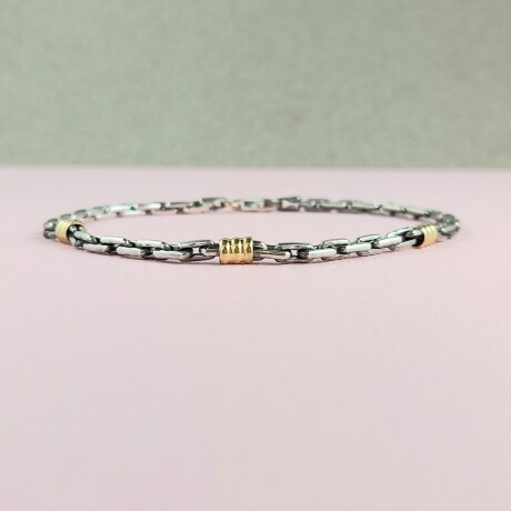 Pulsera de plata 925 con detalles en double de oro 18 ktes. Pulsera de plata 925 con detalles en double de oro 18 ktes.