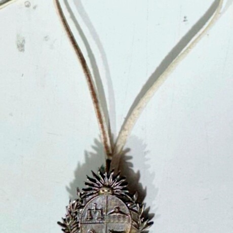 Dije del Emblema Nacional con tiento Dije del Emblema Nacional con tiento