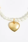 PULSERA ELÁSTICA PERLAS Y CORA Oro