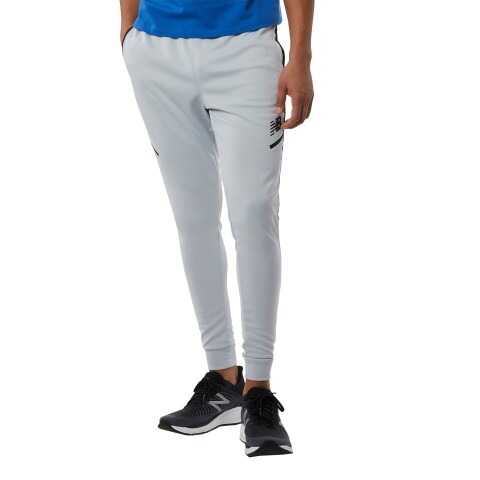 Pantalon New Balance de hombre - TENACITY - MP23091LAN BEIGE