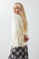 Sweater con flecos beige claro
