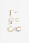 Set de seis aros y earcuff strass dorado