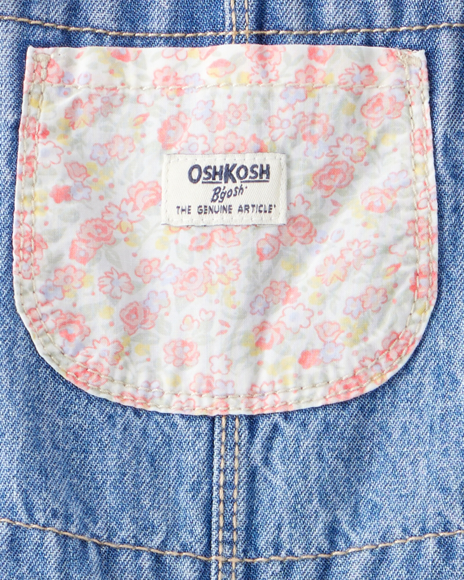 Enterito jean con parches florales. Talles 3-24M Enterito jean con parches florales. Talles 3-24M
