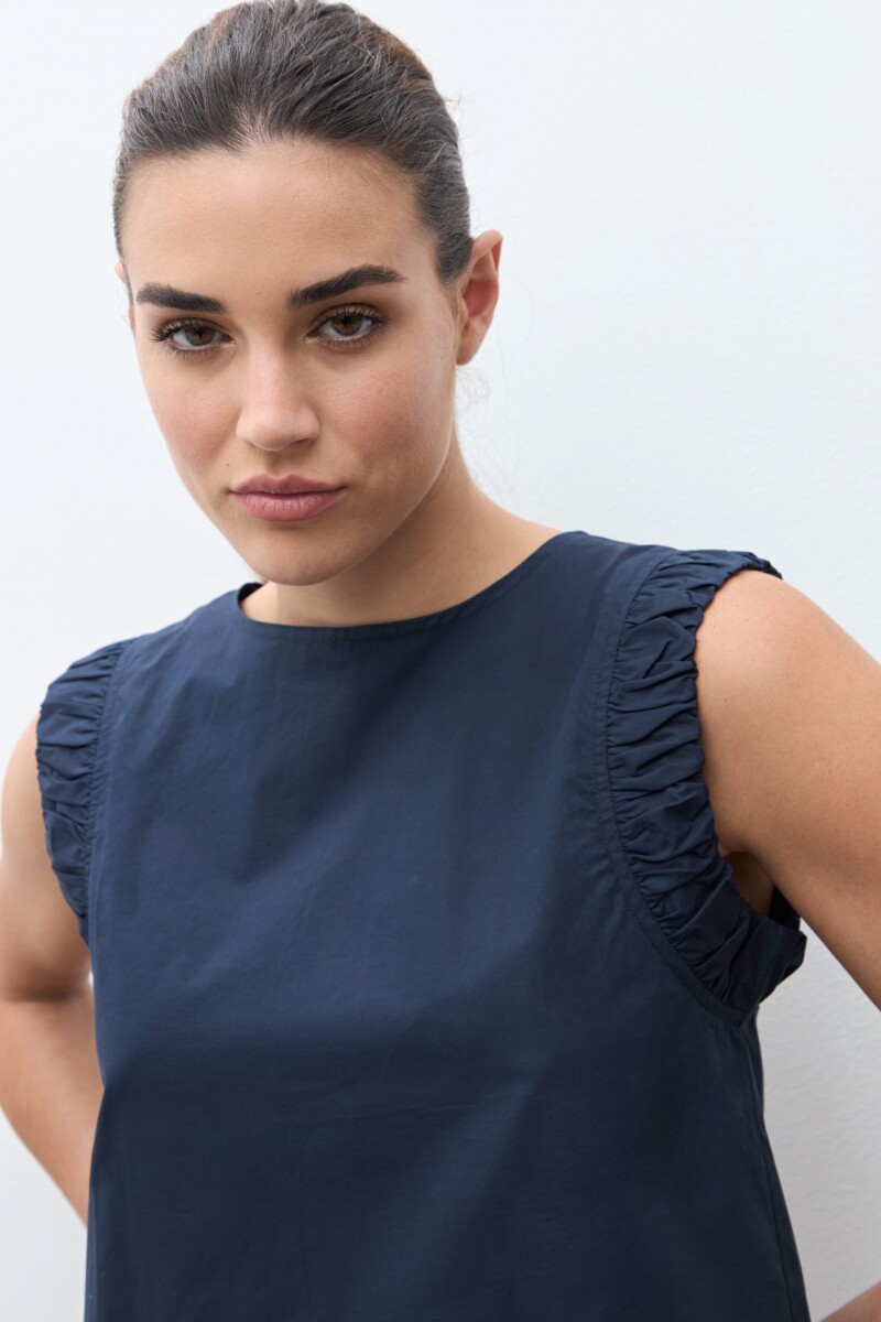 Blusa con sisa drapeada azul marino