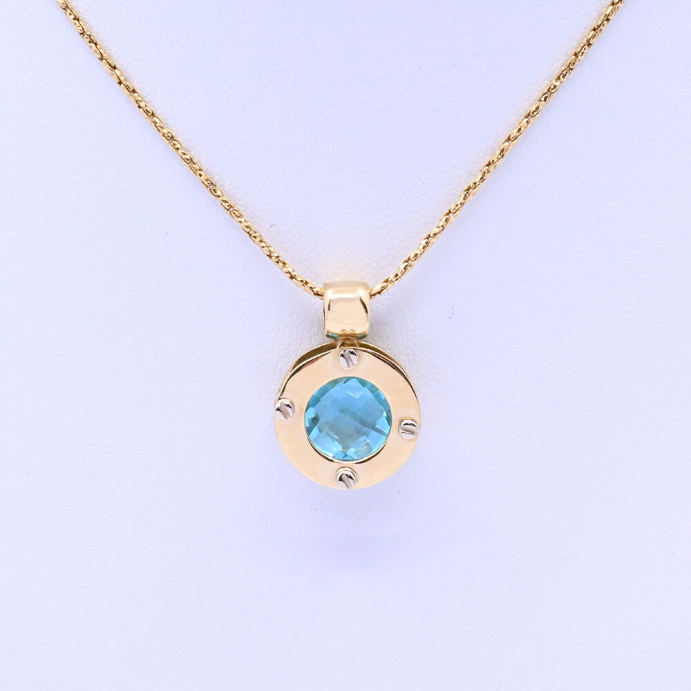 Colgante oro 18k 2 tonos con topacio azul. Colgante oro 18k 2 tonos con topacio azul.