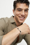 PULSERA ELÁSTICA DE CUENTAS DE ALECIÓN DE METALES BAÑADAS EN PLATA Y CRISTAL DE MURANO NEGRO Pulsera