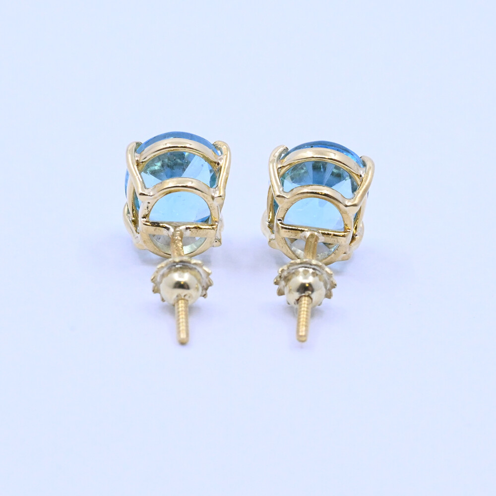 Caravanas oro 18k con topacios azules oval engarce 4 puntas. Caravanas oro 18k con topacios azules oval engarce 4 puntas.