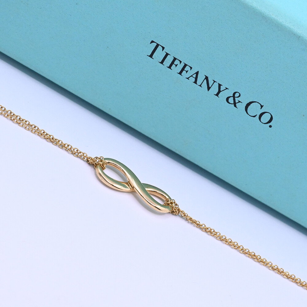 Tiffany & Co. Pulsera infinity oro 18 k amarillo con estuche. Tiffany & Co. Pulsera infinity oro 18 k amarillo con estuche.