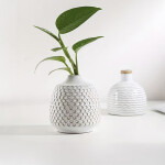 FLORERO RELIEVES D9x10CM CERAMICA BLANCO FLORERO RELIEVES D9x10CM CERAMICA BLANCO