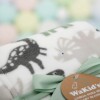 Manta fleece WAKIDS dino verde blanco