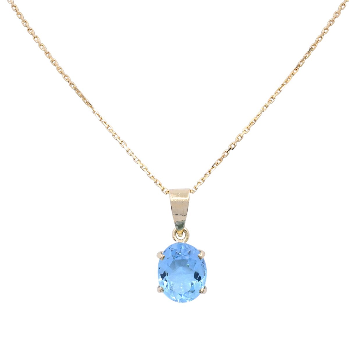 Colgante oro 18k con topacio oval engarce 4 puntas. 