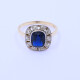 Anillo oro 18k antiguo con piedra de color y brillantes. Anillo oro 18k antiguo con piedra de color y brillantes.