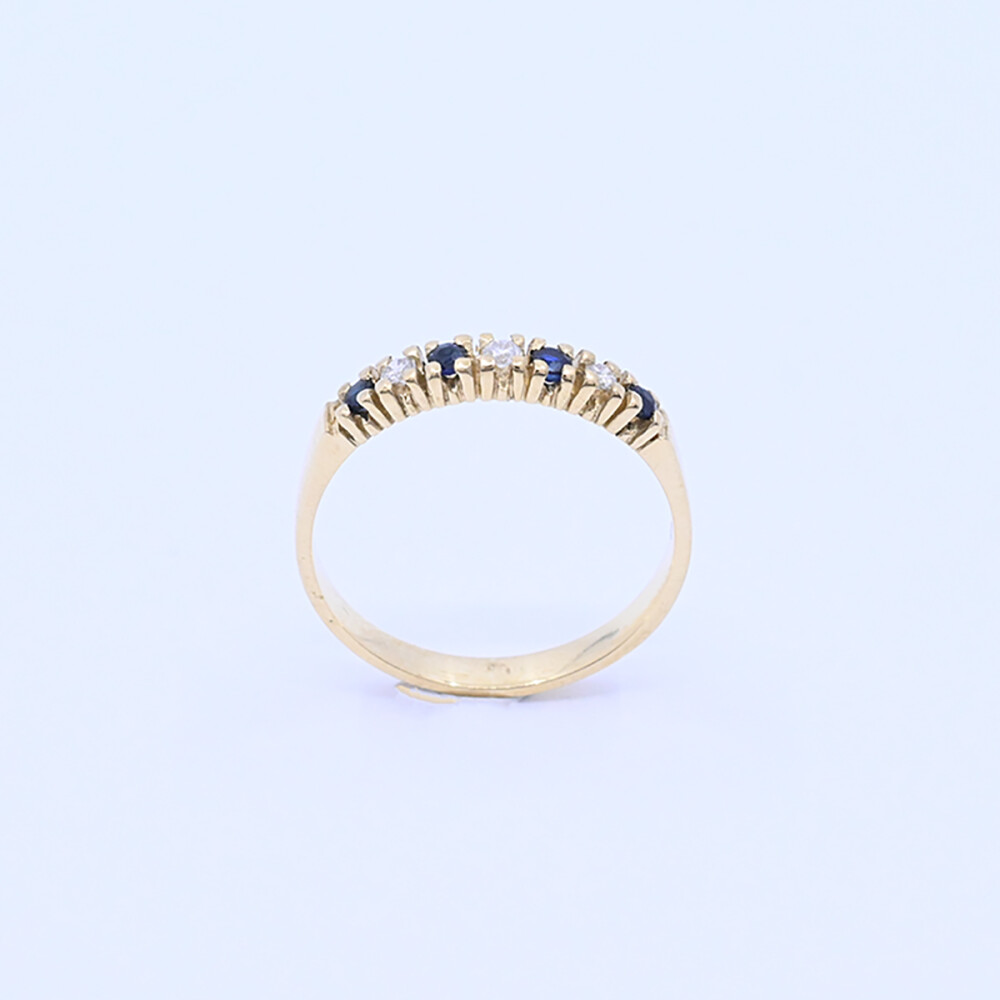 Anillo medio sin fin oro 18k amarillo con 4 zafiros y 3 brillantes. Anillo medio sin fin oro 18k amarillo con 4 zafiros y 3 brillantes.