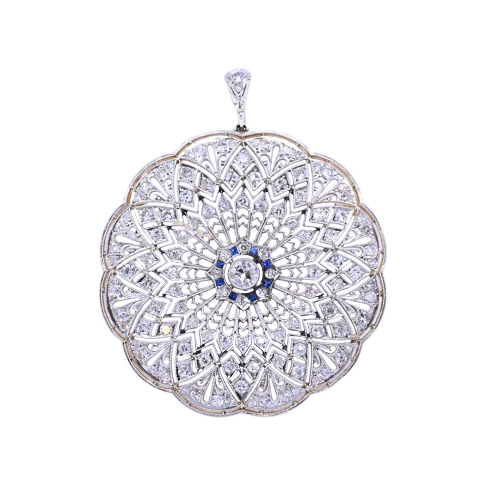 Colgante y prendedor antiguo en oro 18 k, brillantes y zafiros sintéticos. Colgante y prendedor antiguo en oro 18 k, brillantes y zafiros sintéticos.