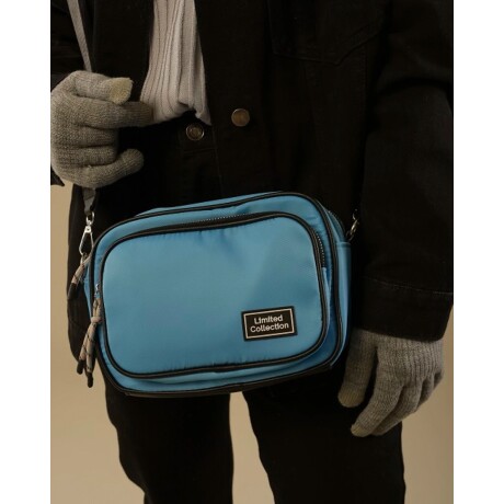 Bandolera Canva Brooklyn celeste con bolsillo antirrobo y correa ajustable Celeste
