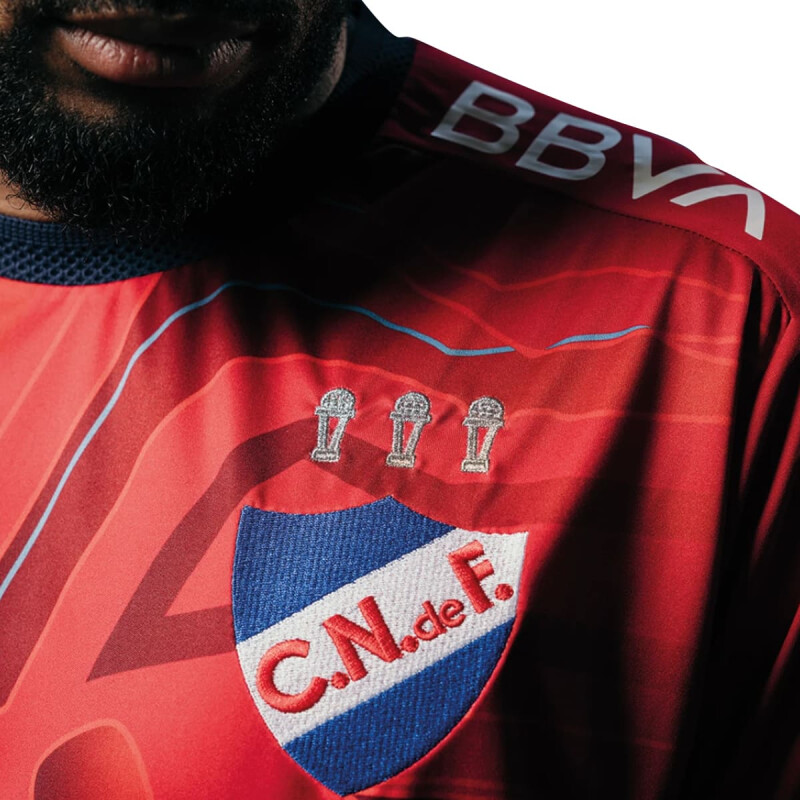 Camiseta - Umbro - UMBRO CAMISETA GOLERO OFICIAL 2025 CNF de Hombre - NU143052 Rojo-blanco