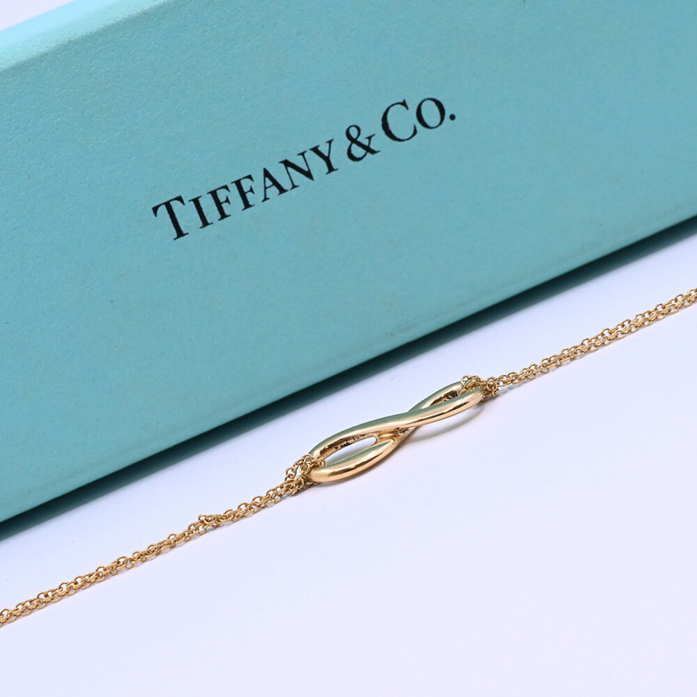 Tiffany & Co. Pulsera infinity oro 18 k amarillo con estuche. Tiffany & Co. Pulsera infinity oro 18 k amarillo con estuche.