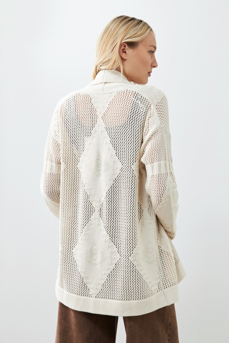 Ruana con flecos beige claro
