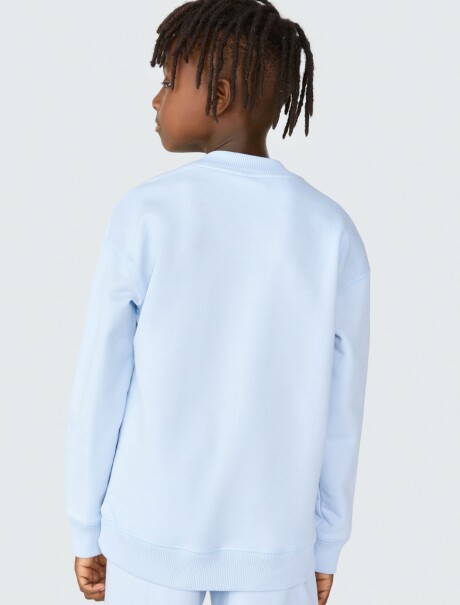 BUZO INFANTIL CON ESTAMPA MODELO OVERSIZE CELESTE