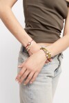 PULSERA DE HILO NEGROSO CON PERLA SHELL FORNITURA BAÑADA EN ORO 18K. Pulsera