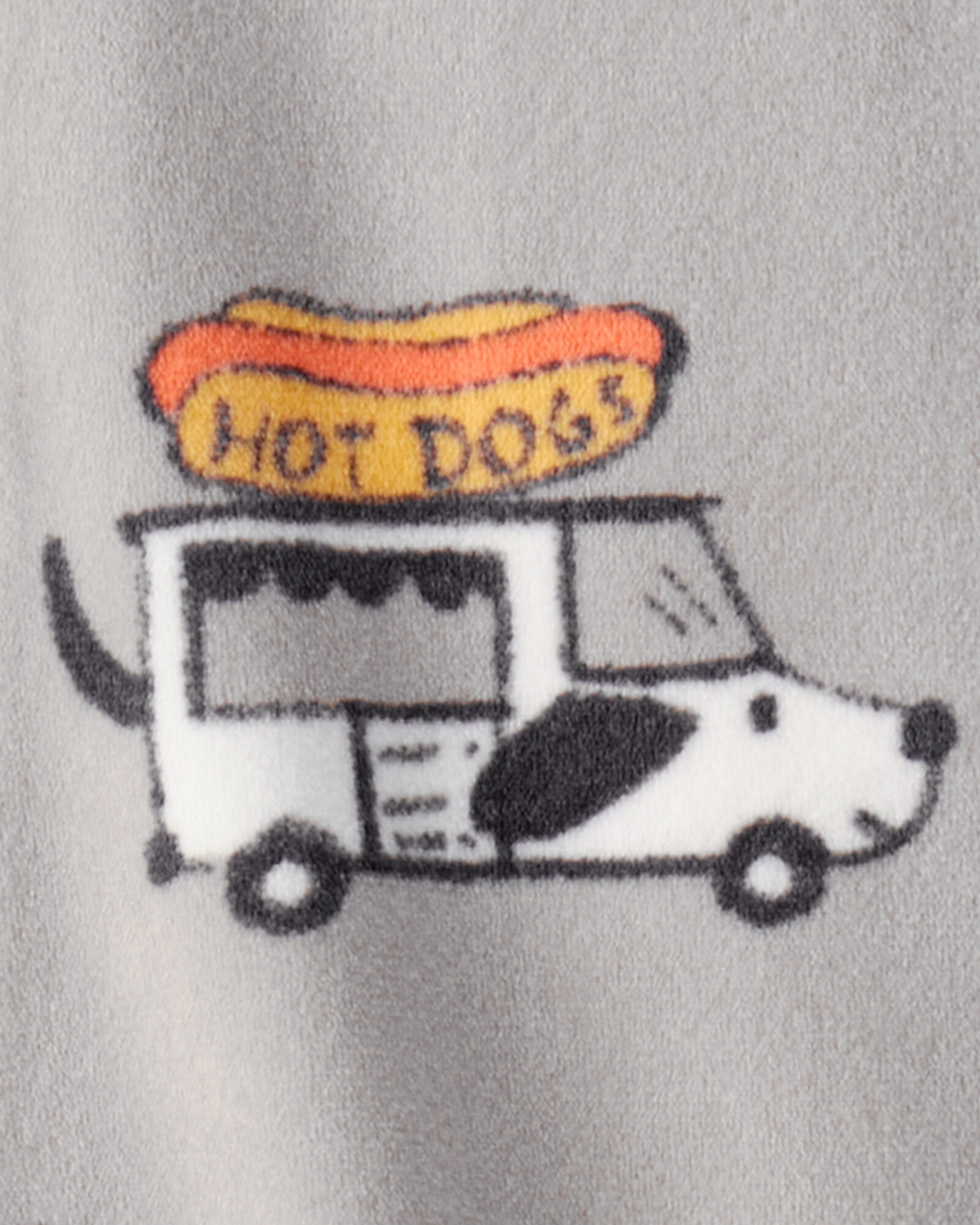 Pijama una pieza de micropolar, con pie, diseño camiones de comida Pijama una pieza de micropolar, con pie, diseño camiones de comida