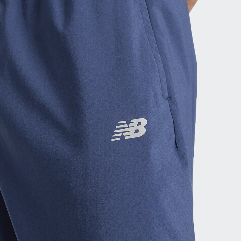Pantalón New Balance Sport Essentials Woven Jogger Azul