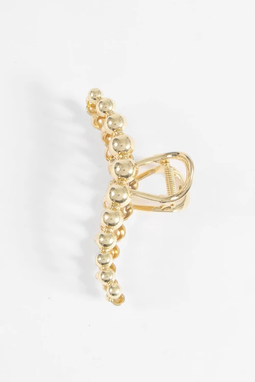 Broche metálico bolas dorado