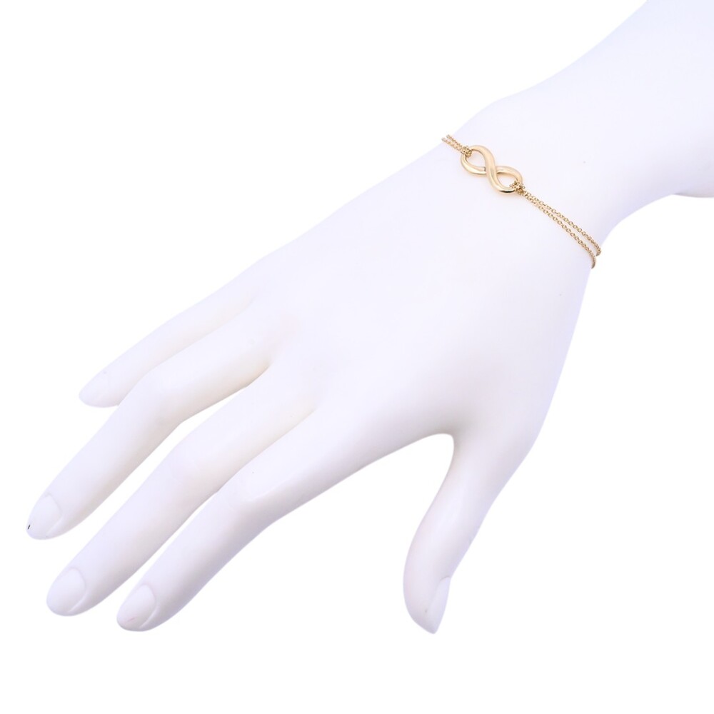 Tiffany & Co. Pulsera infinity oro 18 k amarillo con estuche. Tiffany & Co. Pulsera infinity oro 18 k amarillo con estuche.