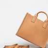 Cartera de mano Capri en cuero liso vegetal Vaqueta