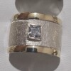 Anillo plata y oro satinado con cubis Anillo plata y oro satinado con cubis