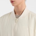 Campera de Dama New Balance -Reimagined Bomber- WJ51502LIN BEIGE