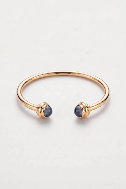 Pulsera rigida detalle dorado
