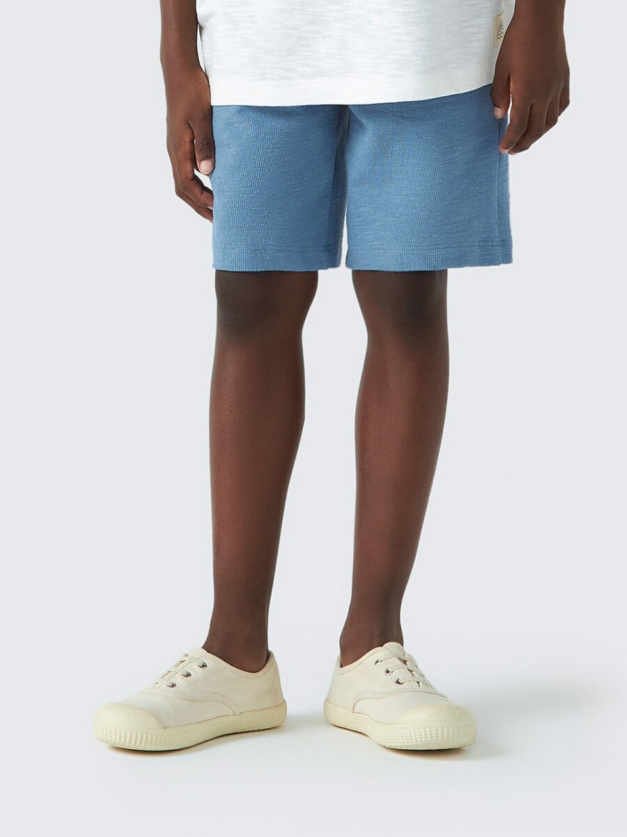 BERMUDA INFANTIL CON BOLSILLO - CELESTE 