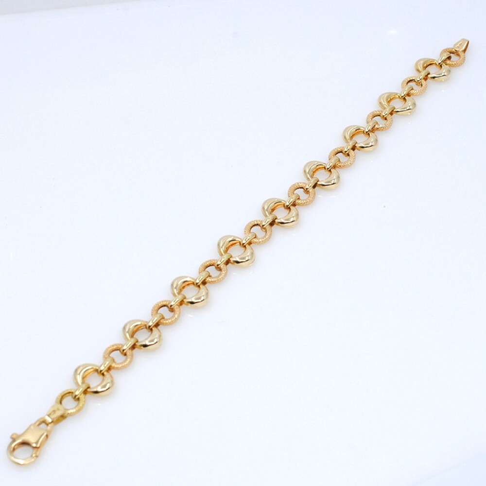 Pulsera en oro 18k con aros lisos y otros labrados Pulsera en oro 18k con aros lisos y otros labrados